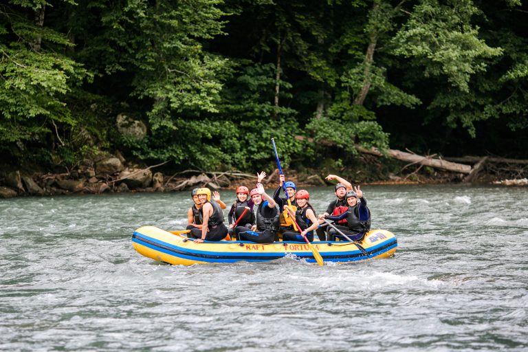 Group enjoying river rafting in Beas River near Kullu during a Manali trip